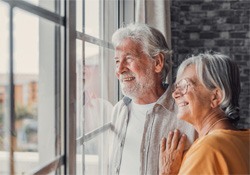 a mature couple smiling with dentures in Downers Grove