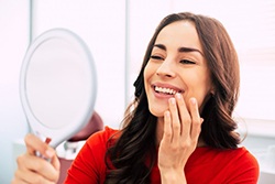 Patient in Downers Grove smiling with their dental bridge