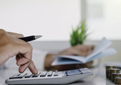 man using a calculator