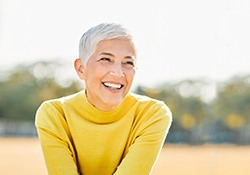 a woman smiling with dentures in Downers Grove