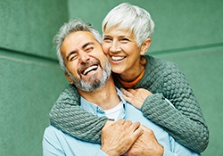 mature couple enjoying benefits of dental implants in Downers Grove
