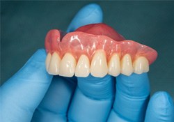 A closeup of a denture for the upper jaw