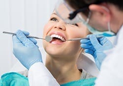 Woman receiving periodontal therapy