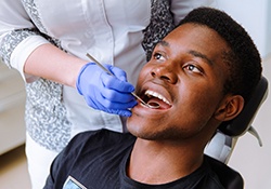 Man visiting his dentist to prevent toothache in Downers Grove