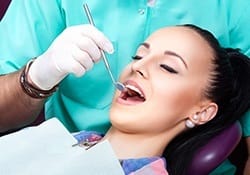 Woman receiving dental exam