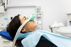 Patient relaxing while wearing nasal mask for nitrous oxide