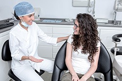 Dentist and patient having friendly, relaxed conversation