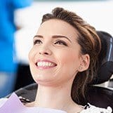 Smiling woman in dental chair