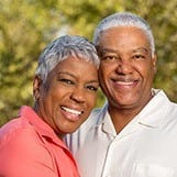 Senior man and woman smiling