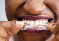 whitening strip representing cost of teeth whitening in Downers Grove